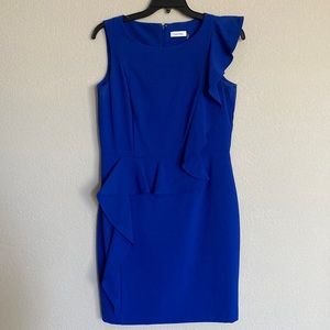 Royal blue cocktail dress with ruffle front detail.